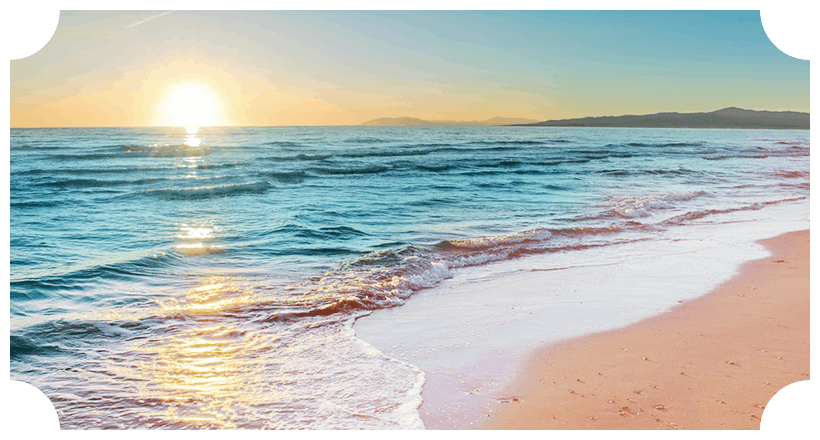 a beach at sunset during summer